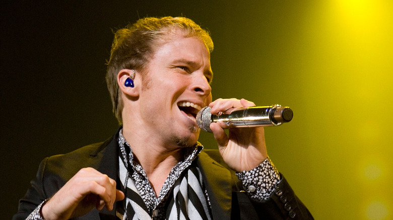 Brian Littrell singing in a black and white outfit