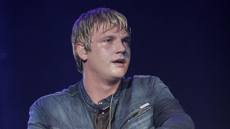 Nick Carter sweating in a denim jacket