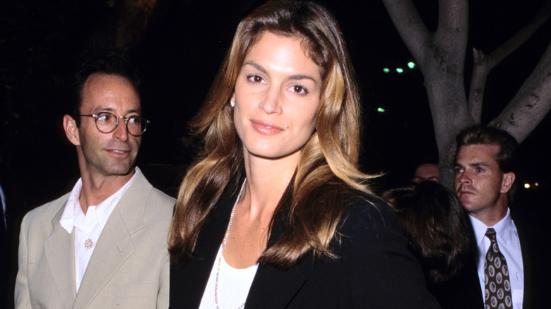 Cindy Crawford smiling in a blazer at 1995 event