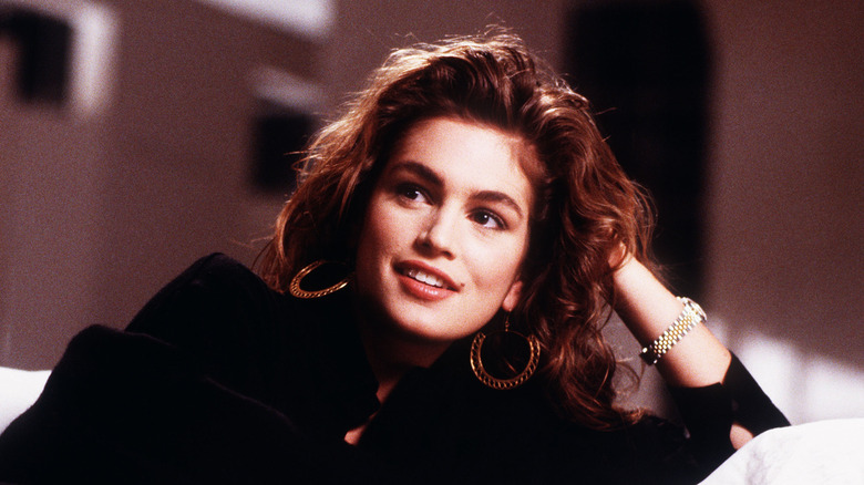 Cindy Crawford posing with feathered hair in 1988