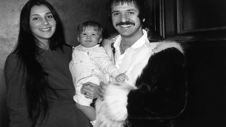 Cher and Sonny Bono holding baby Chaz Bono