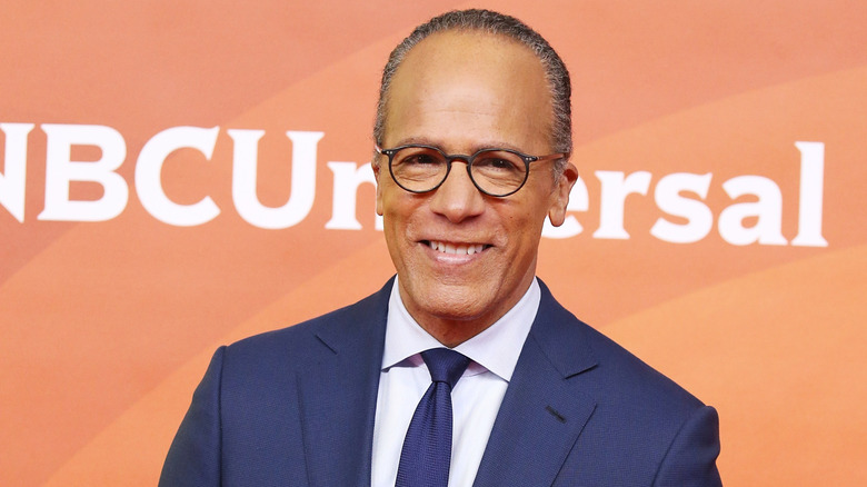 Lester Holt smiles while attending an event for NBCUniversal