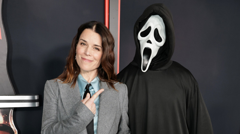Neve Campbell and Ghostface at the Scream 7 premiere