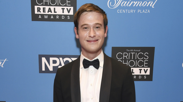 Tyler Henry smiling at the Critics Choice Real TV Awards in 2022