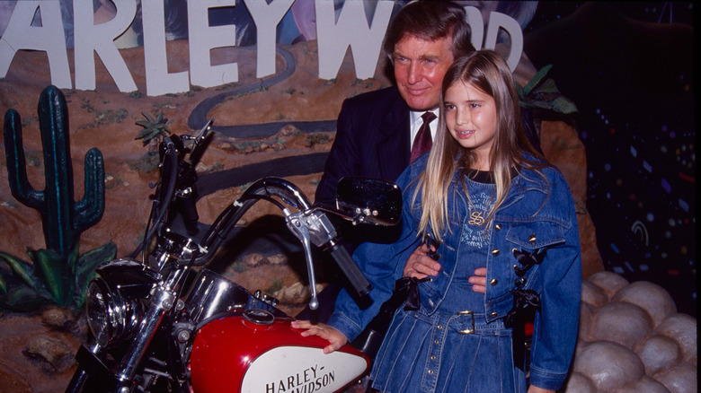 A young Ivanka Trump posing for a picture with Donald Trump