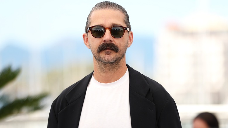Shia LaBeouf attends the premiere of the documentary "Slauson Rec" at the Cannes Film Festival with sunglasses and slicked back hair
