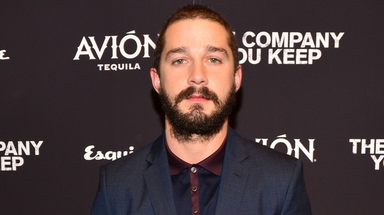 Shia LaBeouf in suit attends the premiere of "The Company You Keep"
