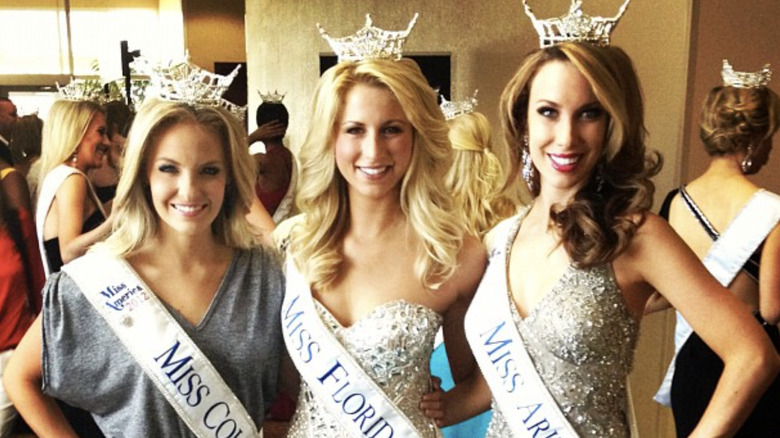 Laura Rutledge posing in crown and sash as Miss Florida with Miss Colorado 2012 and Miss Arizona 2012