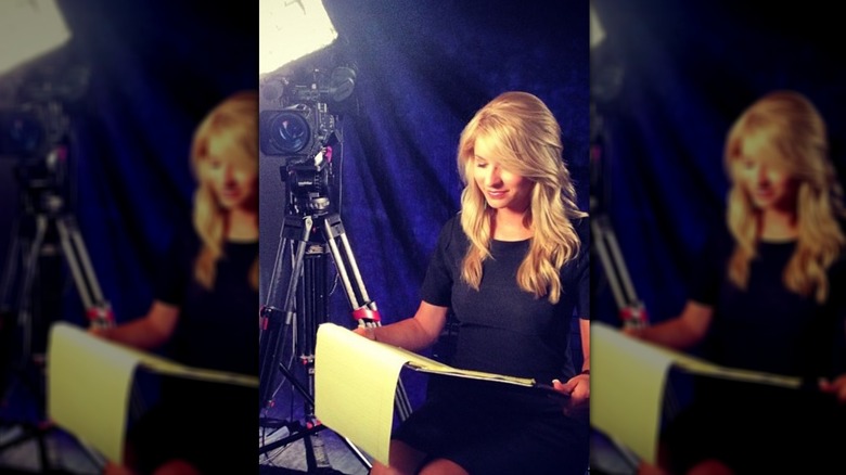 Young Laura Rutledge reading script next to cameras