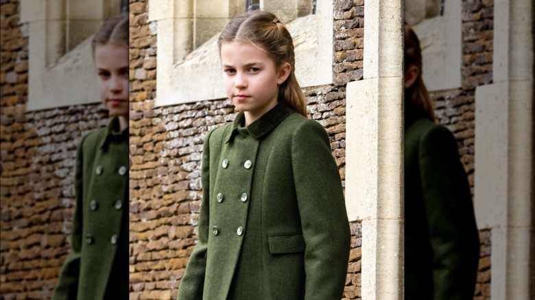 Princess Carlotte glaring at a photographer while wearing a green pea coat