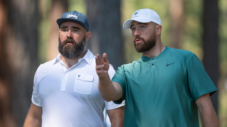 Travis and Jason Kelce talking about strategy at a celebrity golf tournament