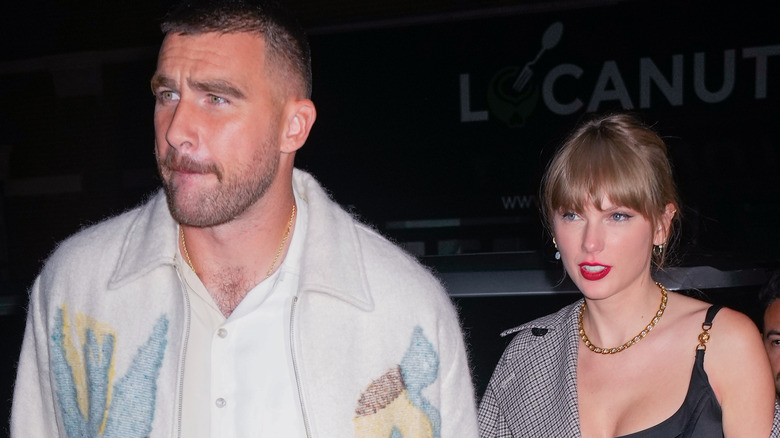 Travis Kelce and Taylor Swift walking together