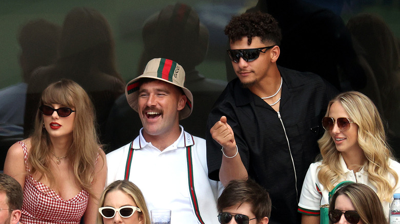 Taylor Swift and Travis Kelce watching a football game with Brittany Mahomes and Patrick Mahomes