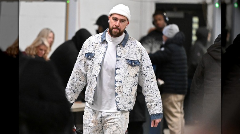 Travis Kelce in a white lace outfit.