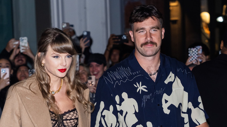 Travis Kelce and Taylor Swift walking together