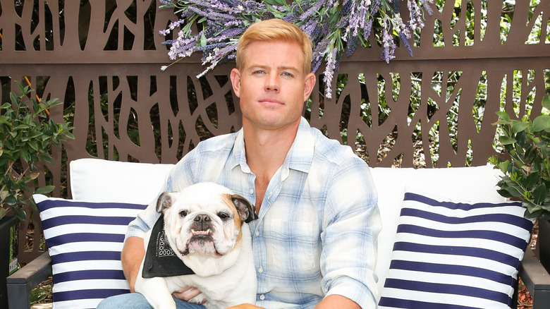 Trevor Donovan poses with a dog