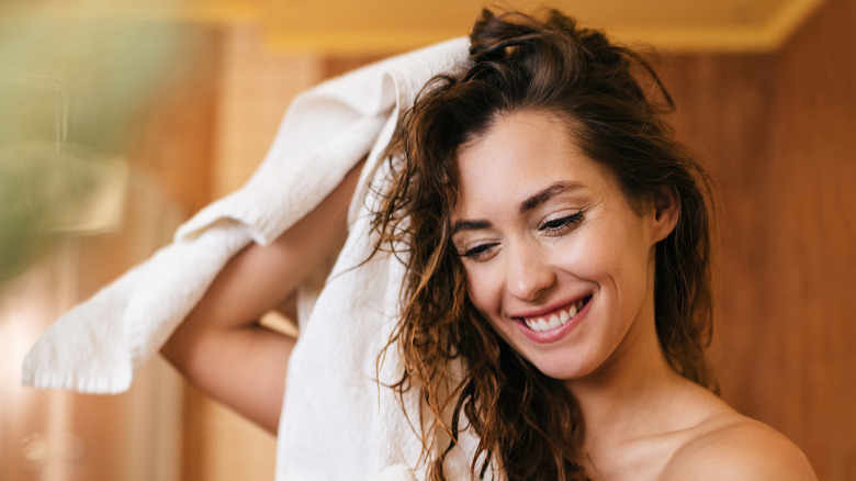 woman towel drying her hair