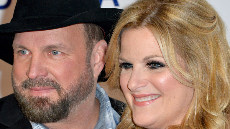 Trisha Yearwood and Garth Brooks smile together