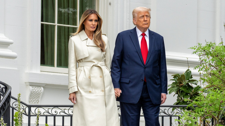 Melania and Donald Trump hold hands