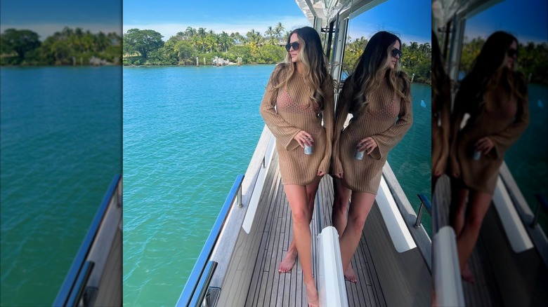 Margo Martin poses on a boat while holding a beverage in May 2023 (2023)