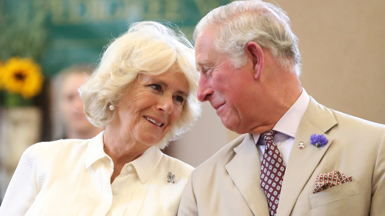 Charles and Camilla looking lovingly at each other