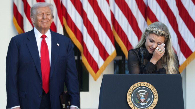Donald Trump standing behind Erika Kirk at the Medal of Honor ceremony for Charlie Kirk