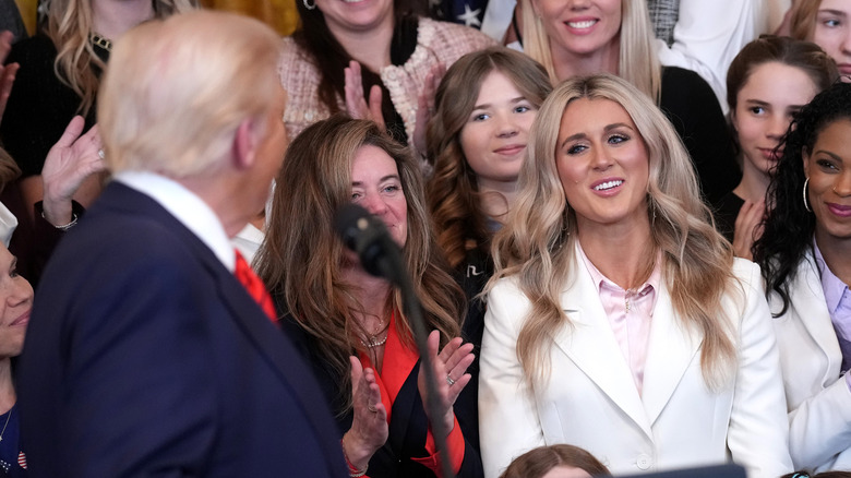 Donald Trump looking at Riley Gaines at a rally