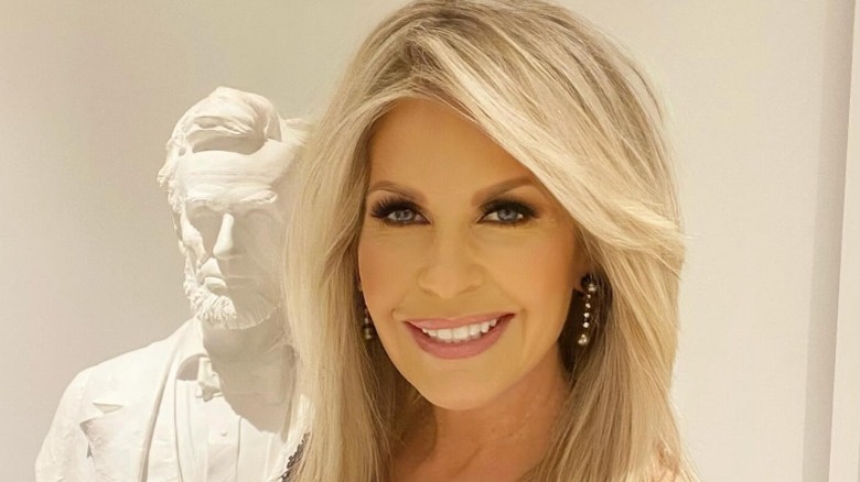 Monica Crowley poses by a bust of Abraham Lincoln in Washington, DC (2025)