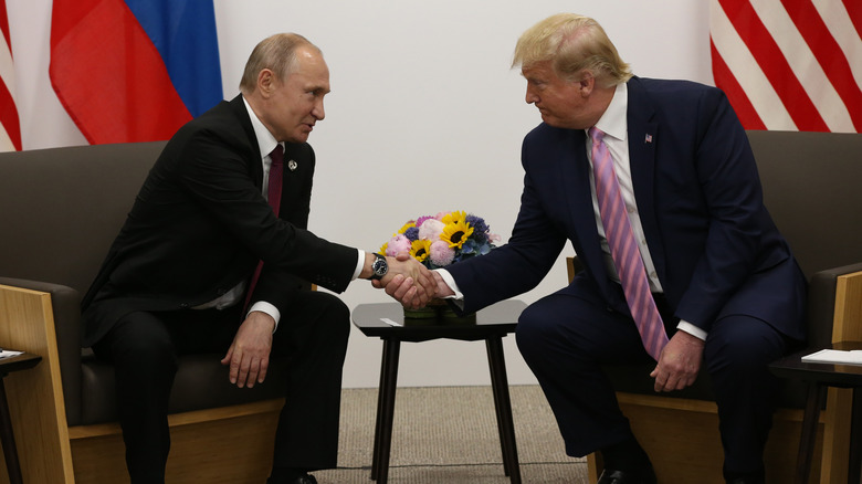 Donald Trump and Vladimir Putin shaking hands