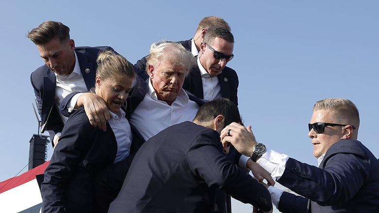 Donald Trump and Secret Service members after Butler, Pennsylvania shooting