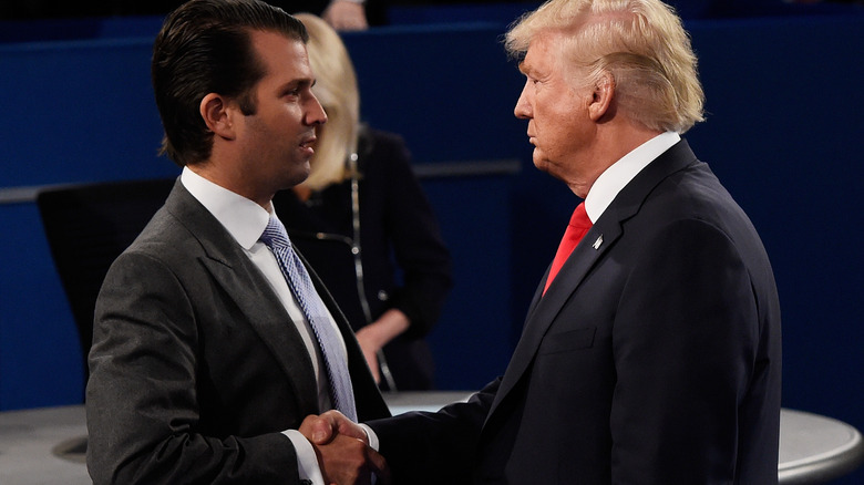 Donald Trump shaking Donald Trump Jr.'s hand
