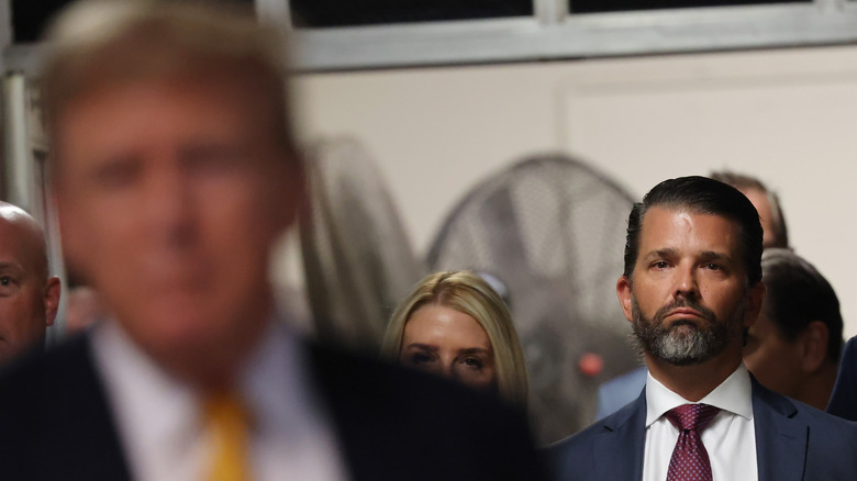 Donald Trump Jr. standing behind Donald Trump