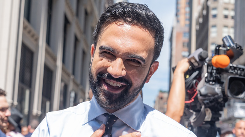 Zohran Mamdani smiles