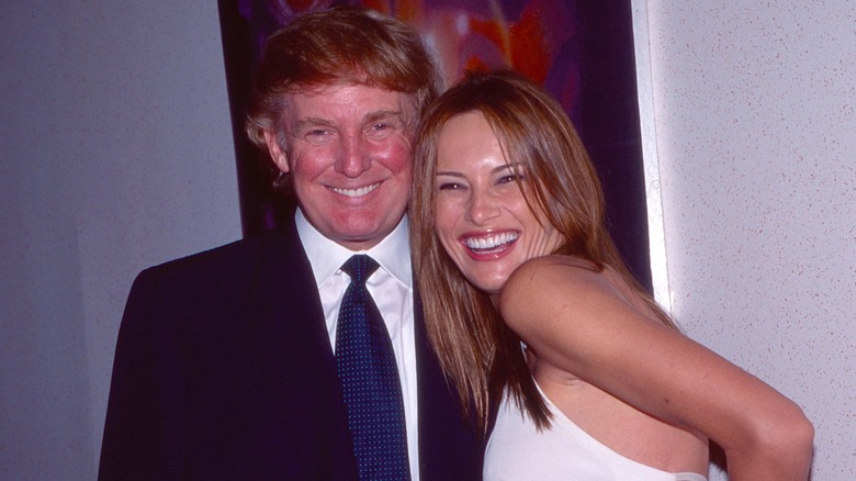 Donald and Melania Trump posing in 1999 shortly after they began dating