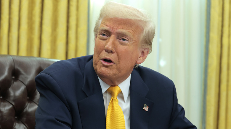 Donald Trump with visible shoulder pad lumps