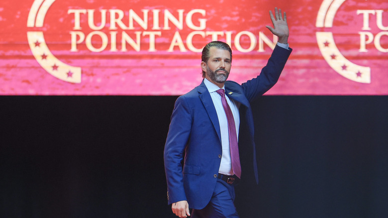 Donald Trump Jr. waving onstage during Charlie Kirk's memorial