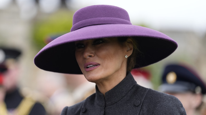 Closeup of Melania Trump wearing a large purple hat