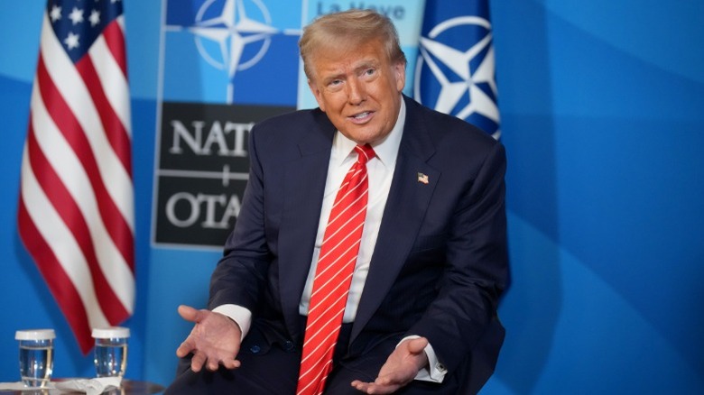 Donald Trump speaks to media during the 2025 NATO summit in The Hague, Netherlands