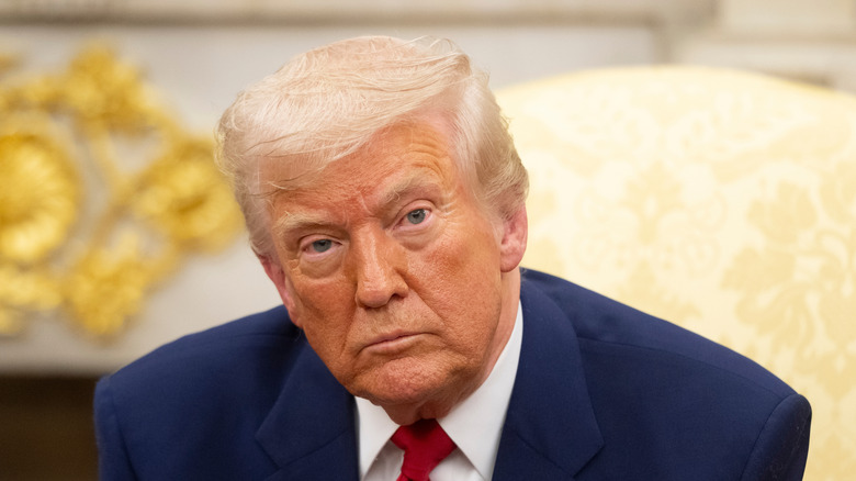 Donald Trump sitting in the Oval Office