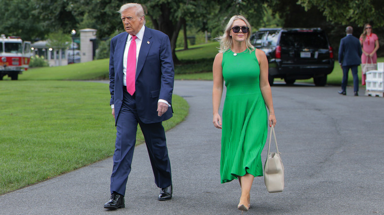 Donald Trump and Karoline Leavitt walking side by side