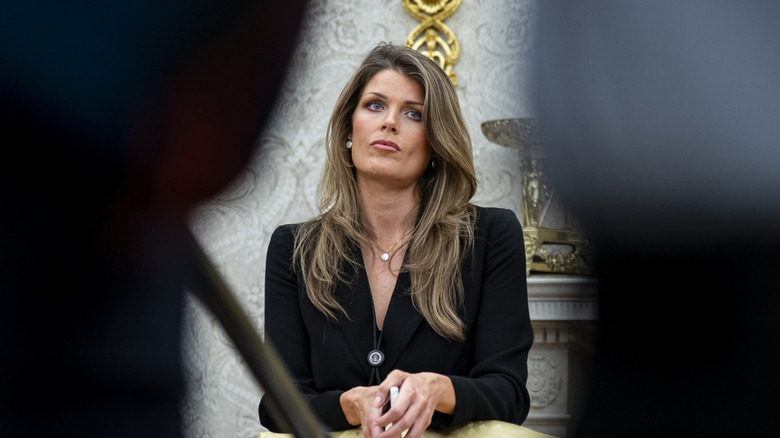 Lindsey Halligan sitting in the Oval Office.