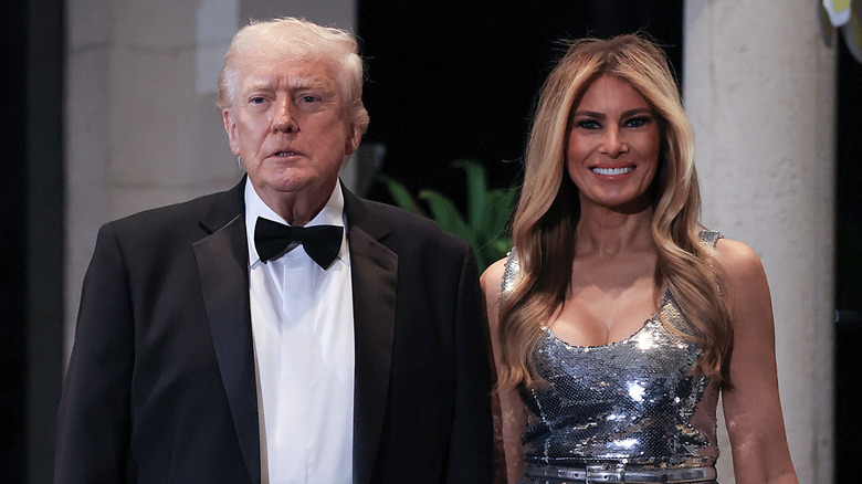 Donald Trump scowling next to Melania Trump