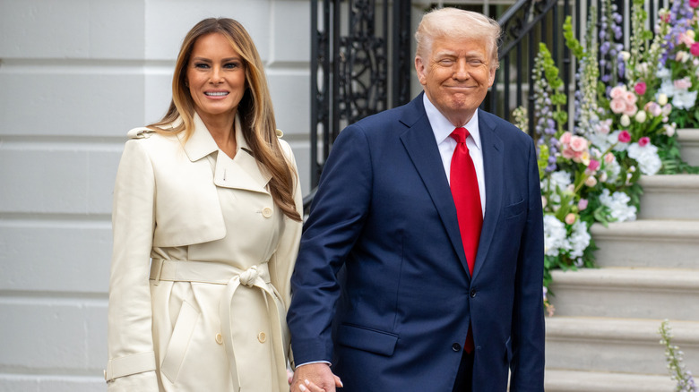Donald and Melania Trump hold hands at the White House Easter Egg Roll