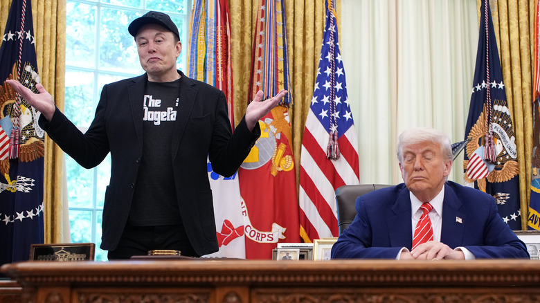 Elon Musk standing next to Donald Trump