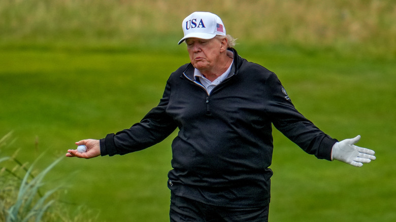 Donald Trump shrugging on the golf course