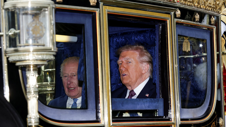 King Charles III and Donald Trump peeking out of the royal carriage