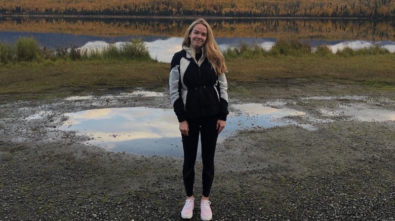 Tricia McLaughlin poses in front of nature in 2020