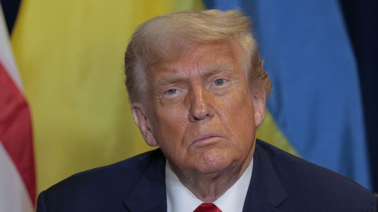 Donald Trump listens during a meeting with Volodymyr Zelensky