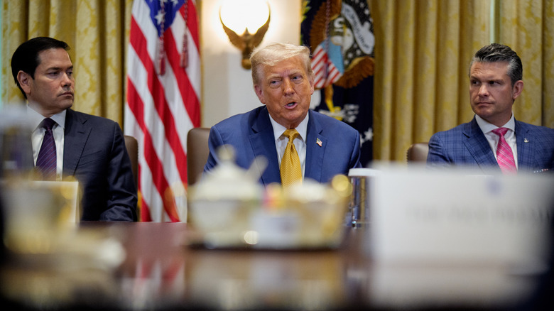 Marco Rubio, Donald Trump, and Pete Hegseth at boardroom table