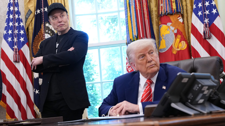 Elon Musk and U.S. President Donald Trump listen to a question from reporters in the Oval Office of the White House on May 30, 2025 in Washington, DC